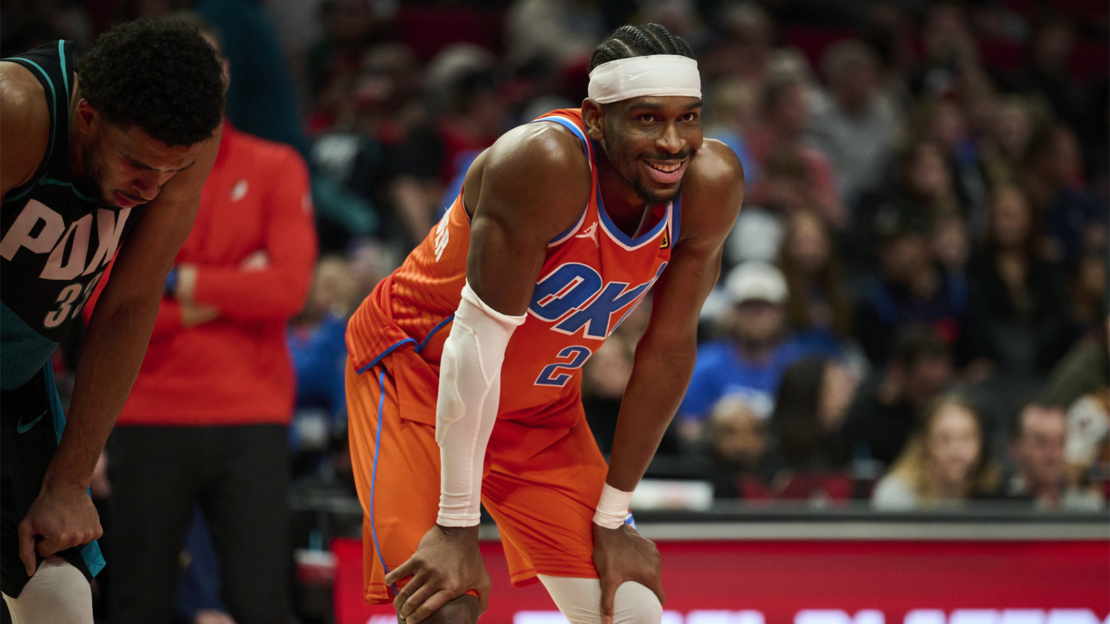 Thunder guard Shai Gilgeous-Alexander (2) smiles at a fan during the second half in a game against the Portland Trail Blazers at Moda Center