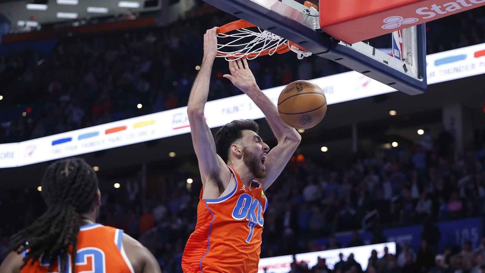 Thunder center Chet Holmgren (7) dunks against the Atlanta Hawks during the second half at Paycom Center