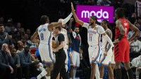 Thunder forward Jalen Williams (8) and guard Isaiah Joe (11) high five during a break in the second half against the Portland Trail Blazers at Moda Center