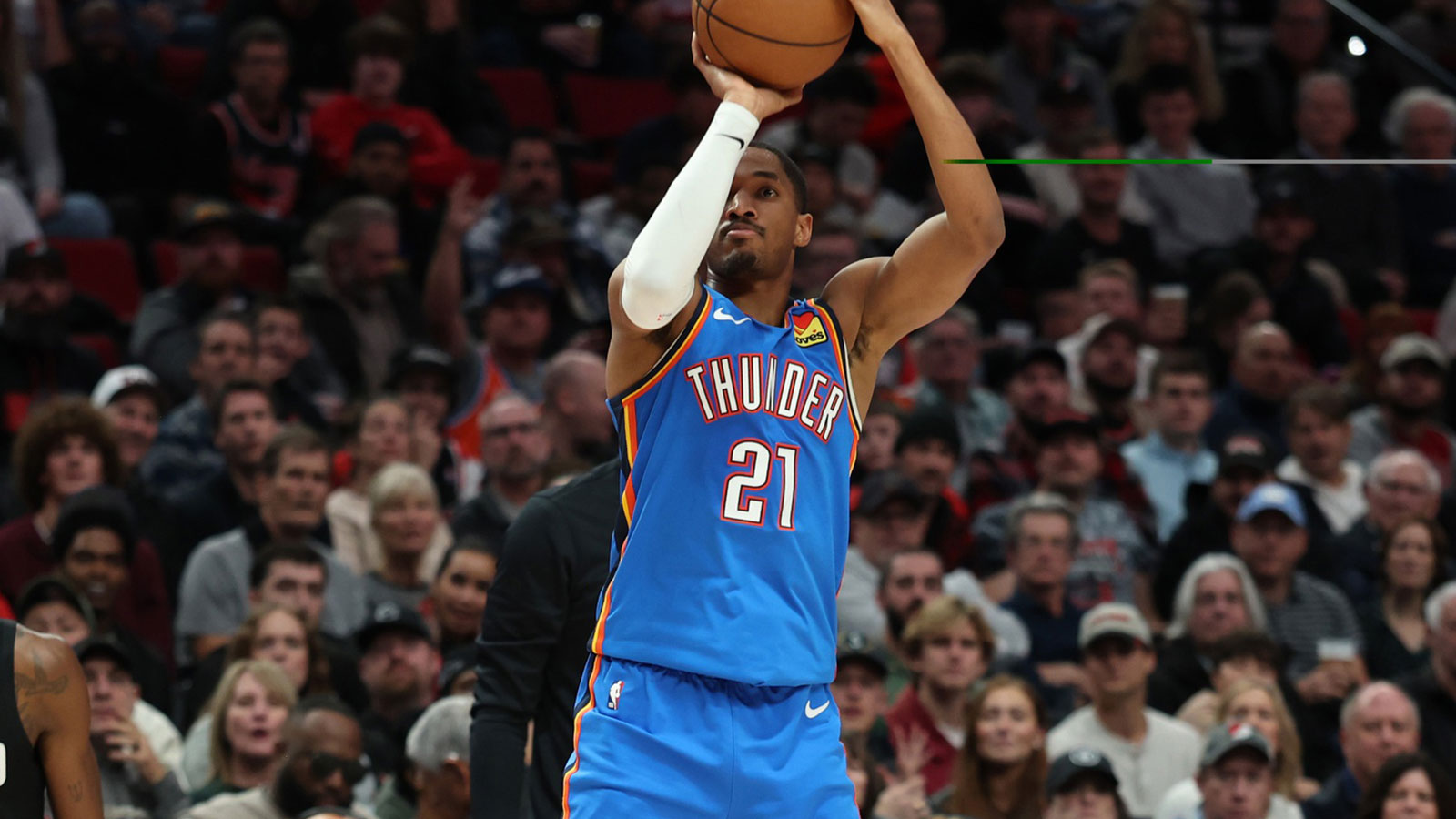 Thunder guard Aaron Wiggins (21) shoots the ball over Portland Trail Blazers center Duop Reath (26) during the first half at Moda Center