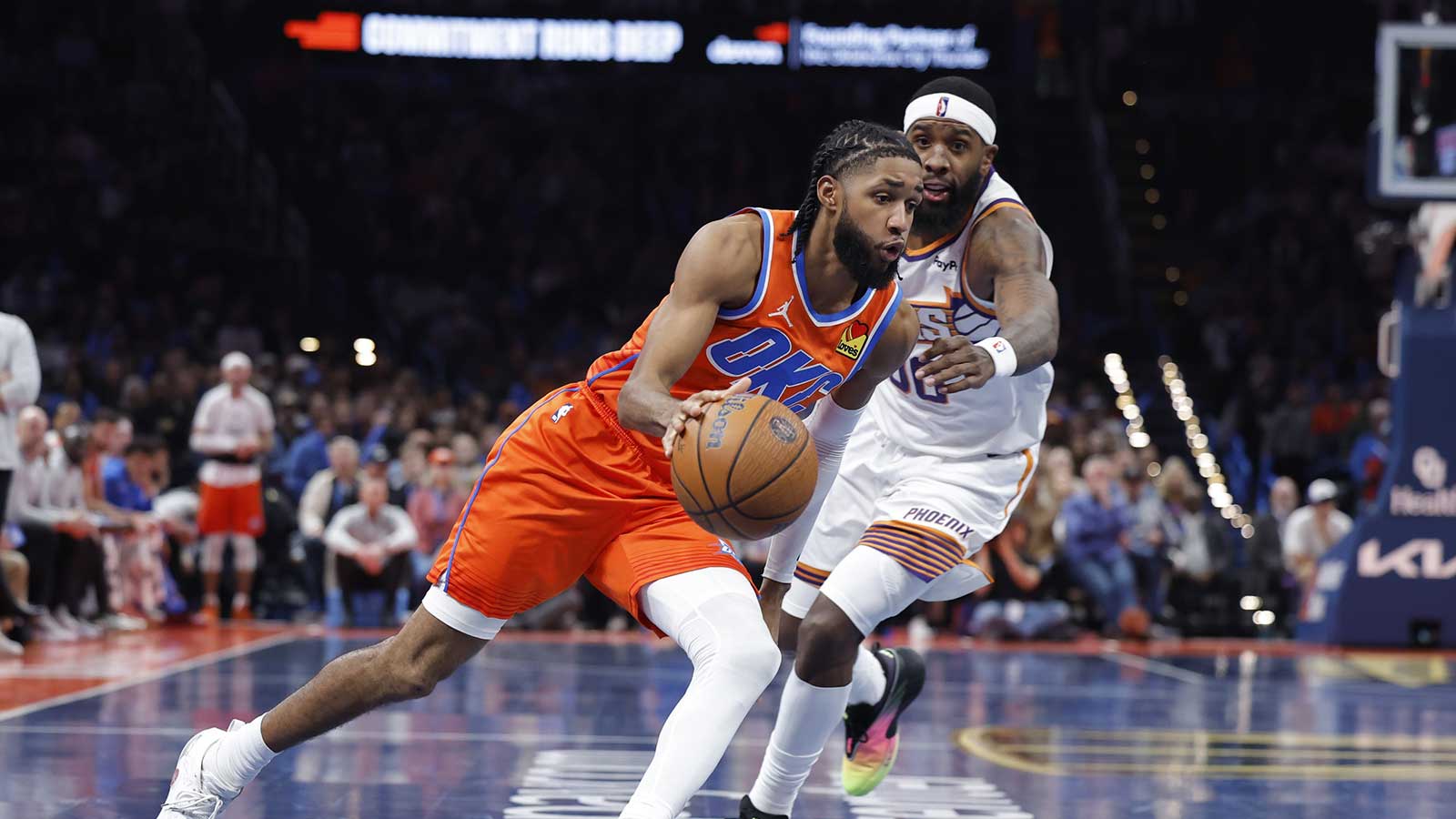 Thunder guard Isaiah Joe (11) drives past Phoenix Suns forward Royce O'Neale (00) during the second half at Paycom Center