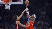 Thunder guard Shai Gilgeous-Alexander (2) shoots as Atlanta Hawks guard Dyson Daniels (5) defends the shot during the first quarter at Paycom Center