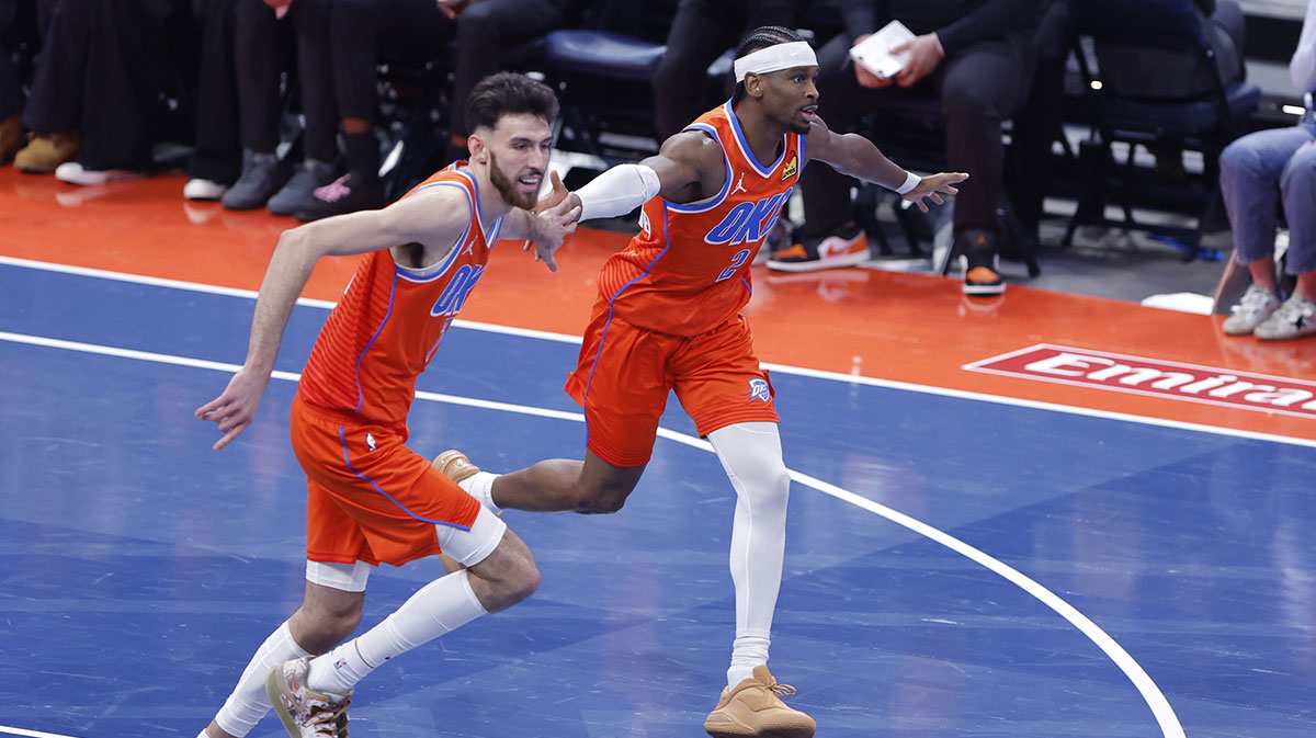 Thunder guard Shai Gilgeous-Alexander (2) and center Chet Holmgren (7) celebrate after scoring against the Phoenix Suns during the third quarter at Paycom Center