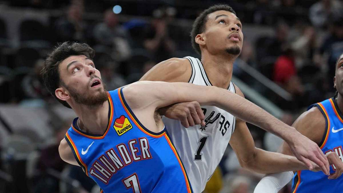 Thunder forward Chet Holmgren (7) and San Antonio Spurs center Victor Wembanyama (1) battle for position in the first half at Frost Bank Center