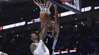 Spurs forward Victor Wembanyama (1) dunks over Oklahoma City Thunder guard Jalen Williams (8) during the second quarter at Paycom Center