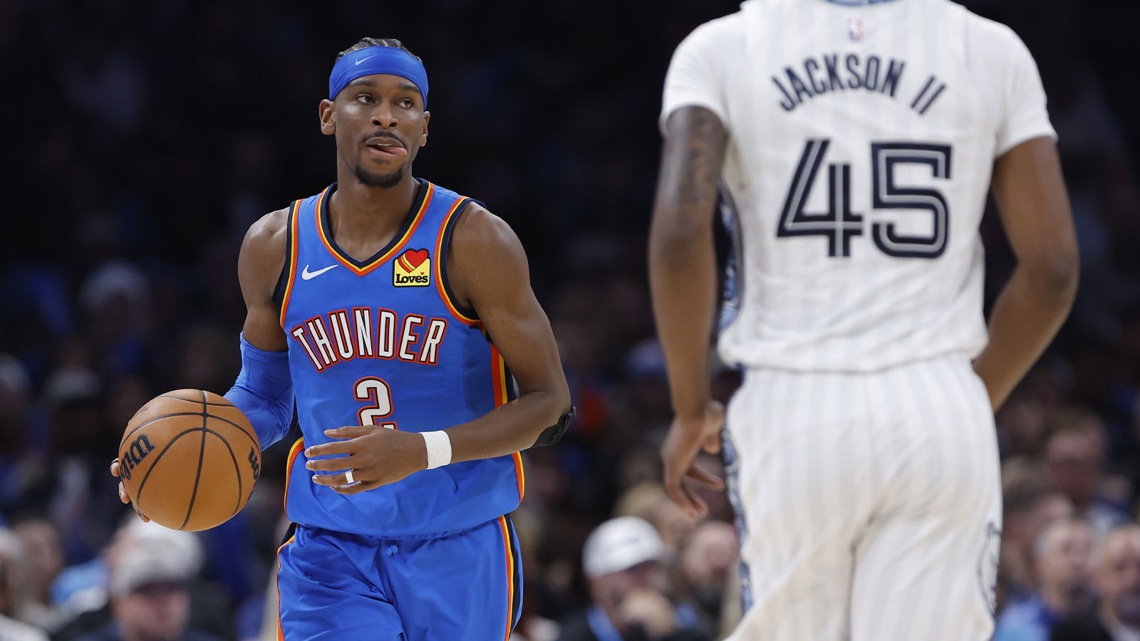 Thunder guard Shai Gilgeous-Alexander (2) dribbles down the court against the Memphis Grizzlies during the second half at Paycom Center