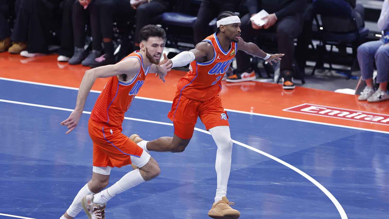 Thunder guard Shai Gilgeous-Alexander (2) and center Chet Holmgren (7) celebrate after scoring against the Phoenix Suns during the third quarter at Paycom Center