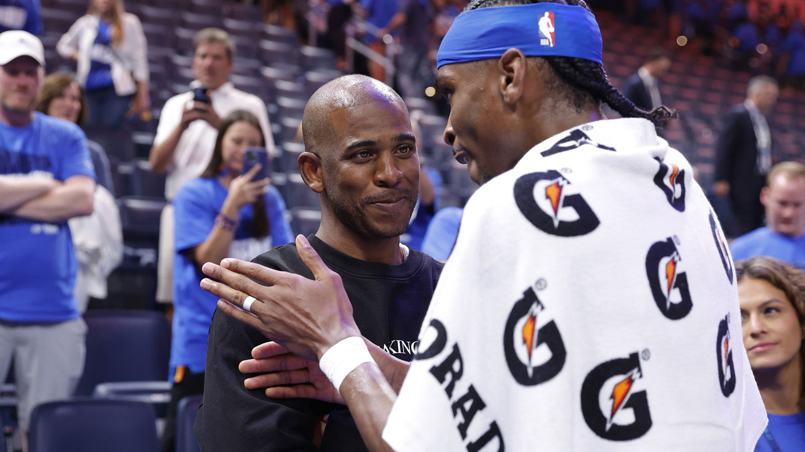 Thunder guard Shai Gilgeous-Alexander (2) talks to Chris Paul after defeating the Minnesota Timberwolves during game two of the western conference finals for the 2025 NBA Playoffs at Paycom Center