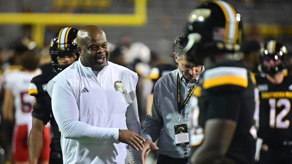 Southern Miss Golden Eagles head coach Charles Huff reacts with players and staff after the game against the Jacksonville State Gamecocks.