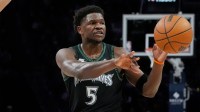 Minnesota Timberwolves guard Anthony Edwards (5) passes the ball against the Brooklyn Nets in the first quarter at Target Center.