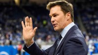 Tom Brady waves at Detroit Lions fans at Ford Field in Detroit.