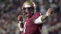Florida State Seminoles quarterback Tommy Castellanos (1) celebrates a touchdown during the second half against the Wake Forest Demon Deacons at Doak S. Campbell Stadium.