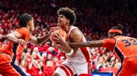 Auburn Tigers forward Sebastian Williams-Adams (33) fouls Arizona Wildcats forward Koa Peat (10) during the second half of the game at McKale Memorial Center.
