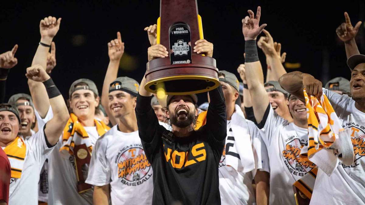 Tennessee head coach Tony Vitello holds up the trophy after game three of the NCAA College World Series finals between Tennessee and Texas A&M at Charles Schwab Field.