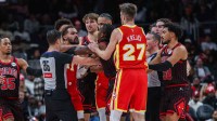 Atlanta Hawks guard Trae Young (11) starts a verbal altercation against Chicago Bulls guard Ayo Dosunmu (11) then referee Jason Goldenberg (35), guard Vit Krejci (27), forward Zaccharie Risacher (10), forward Matas Buzelis (14), guard Josh Giddey (3), and guard Tre Jones (30) step in during the fourth quarter at State Farm Arena.