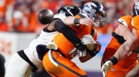 Jacksonville Jaguars defensive end Travon Walker (44) hits Denver Broncos quarterback Bo Nix (10) during the second half at Empower Field at Mile High.