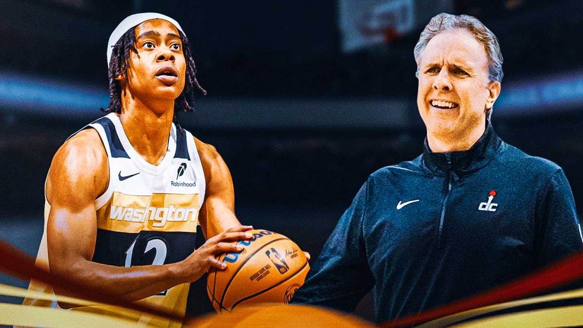 Tre Johnson shoots basketball and smiles next to Brian Keefe