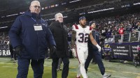New England Patriots running back Treveyon Henderson (32) walks off the field after an apparent injury during the game against the Baltimore Ravens at M&T Bank Stadium