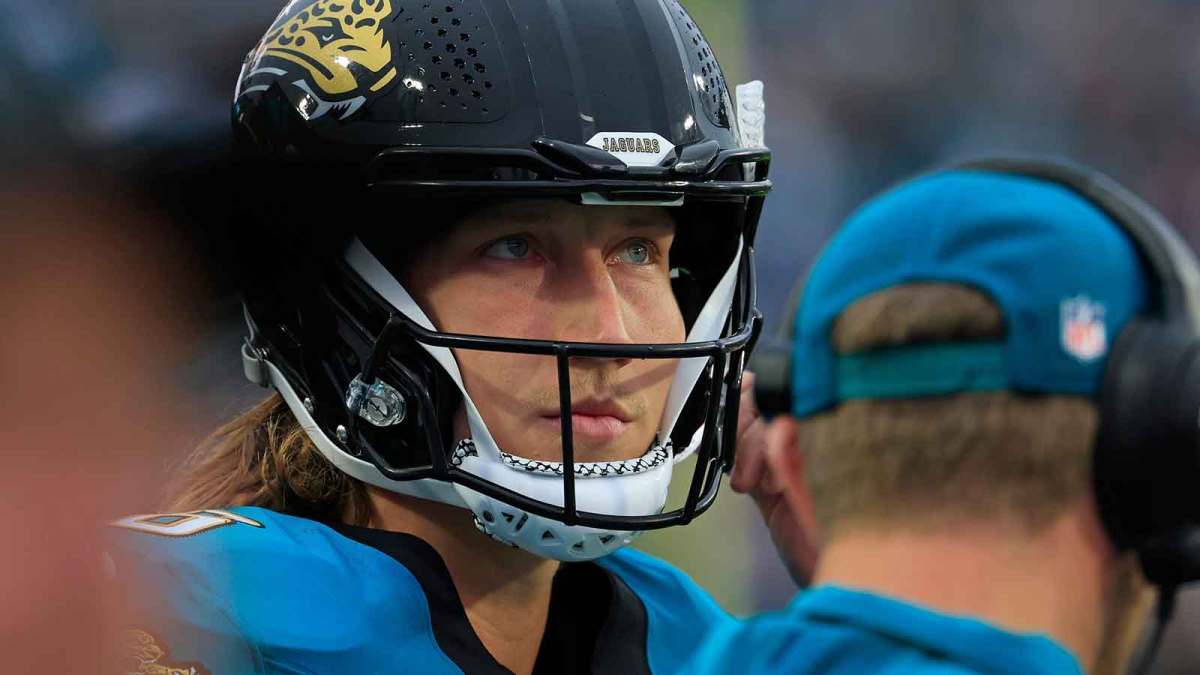 Jacksonville Jaguars quarterback Trevor Lawrence (16) looks on near head coach Liam Coen during the first quarter of an NFL football game at EverBank Stadium, Sunday, Dec. 7, 2025, in Jacksonville, Fla. The Jaguars defeated the Colts 36-19.