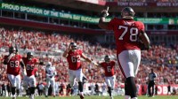 Tampa Bay Buccaneers offensive tackle Tristan Wirfs (78) celebrates with teammates after scoring a touchdown during the first half against the Arizona Cardinals at Raymond James Stadium