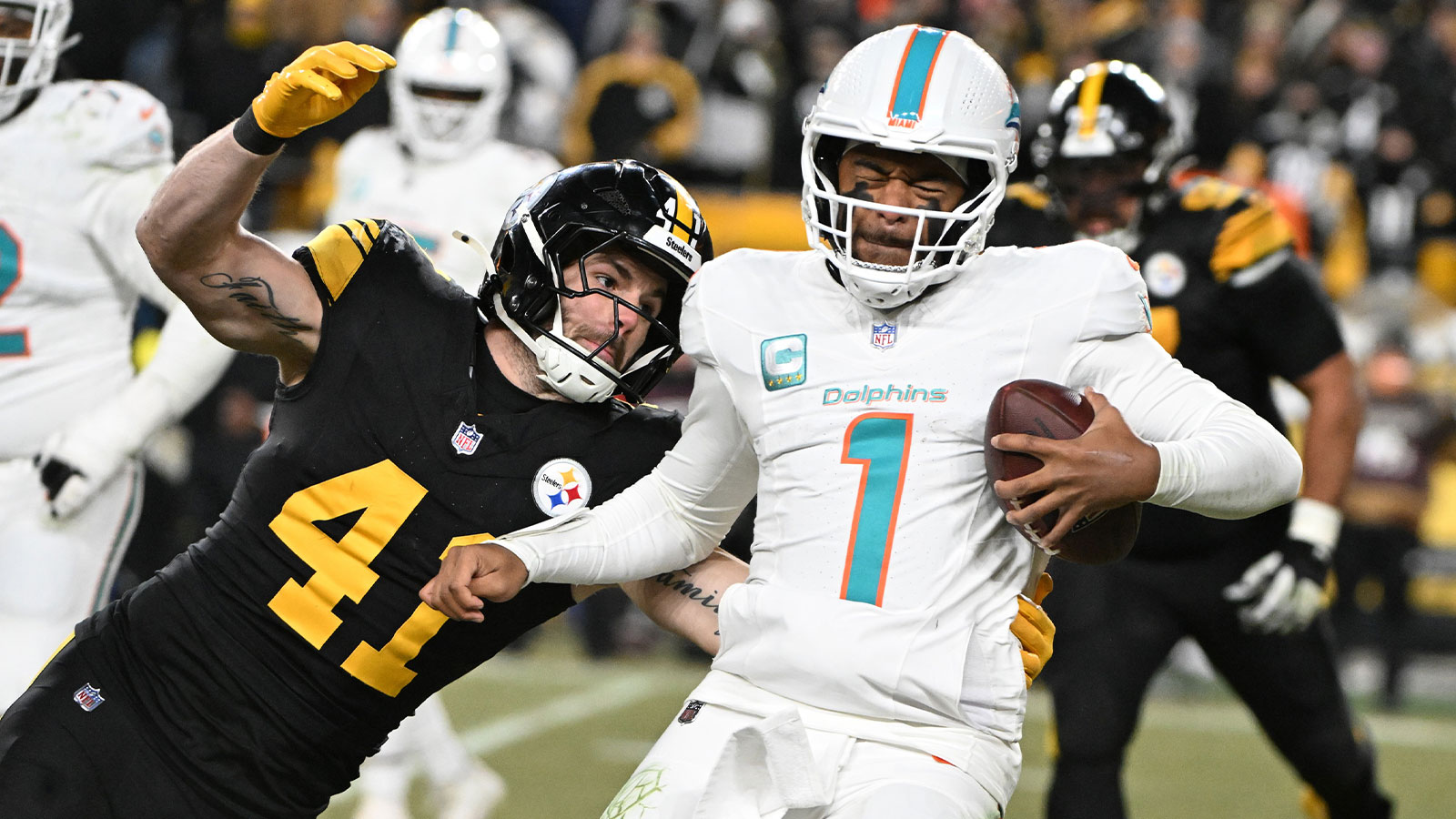 Pittsburgh Steelers linebacker Payton Wilson (41) sacks Miami Dolphins quarterback Tua Tagovailoa (1) in the third quarter at Acrisure Stadium.