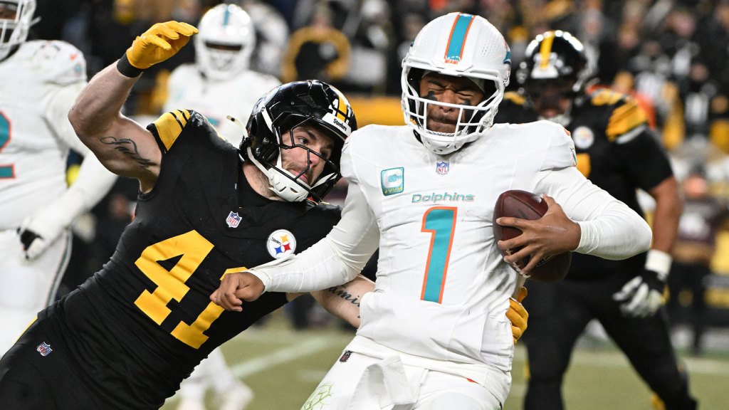 Pittsburgh Steelers linebacker Payton Wilson (41) sacks Miami Dolphins quarterback Tua Tagovailoa (1) in the third quarter at Acrisure Stadium.