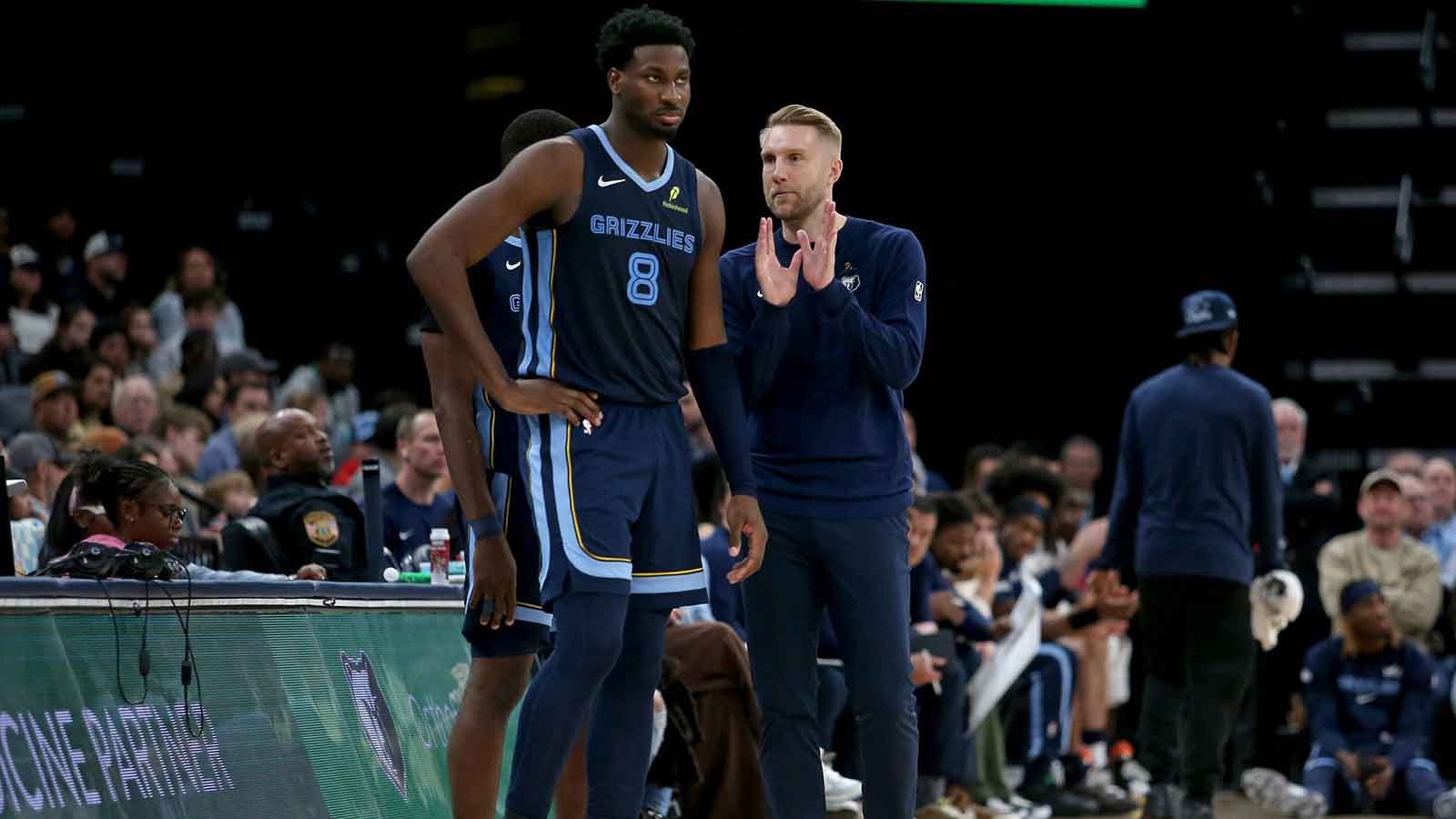 Memphis Grizzlies head coach Tuomas Iisalo talks with forward/center Jaren Jackson Jr. (8) during the third quarter against the Portland Trail Blazers at FedExForum.