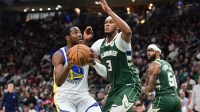 Golden State Warriors forward Jonathan Kuminga (1) looks for a shot against Milwaukee Bucks center Myles Turner (3) in the second quarter at Fiserv Forum