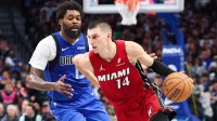 Miami Heat guard Tyler Herro (14) dribbles as Dallas Mavericks forward Naji Marshall (13) defends during the second half at American Airlines Center.
