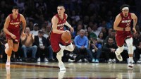 Miami Heat guard Tyler Herro (14) brings the ball up the court against the Dallas Mavericks in the first half at Kaseya Center.