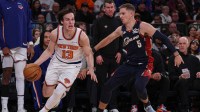 New York Knicks guard Tyler Kolek (13) dribbles as Cleveland Cavaliers guard Sam Merrill (5) defends during the second half at Madison Square Garden.