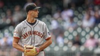 San Francisco Giants relief pitcher Tyler Rogers (71) pitches against the Atlanta Braves during the ninth inning at Truist Park.