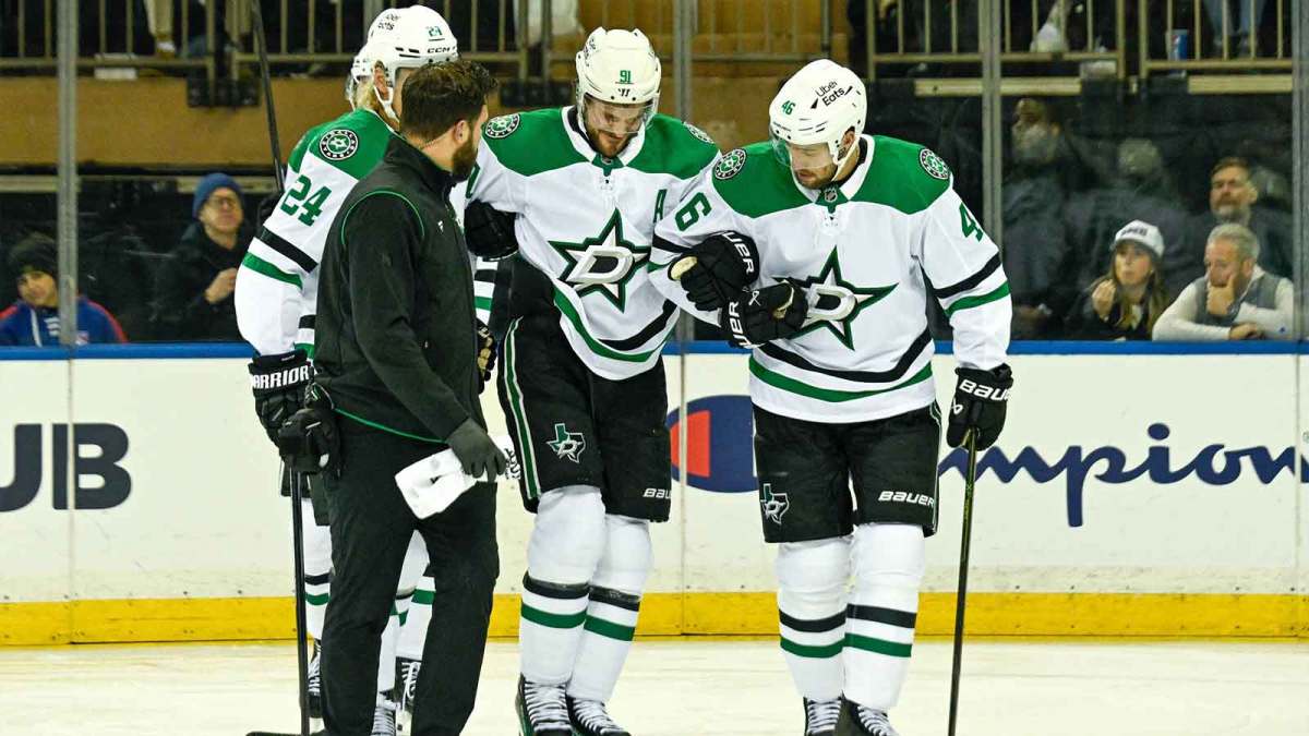 Dallas Stars center Tyler Seguin (91) helped off the ice by Dallas Stars center Roope Hintz (24) and Dallas Stars defenseman Ilya Lyubushkin (46) in the game against the New York Rangers during the first period at Madison Square Garden.