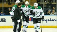 Dallas Stars center Tyler Seguin (91) helped off the ice by Dallas Stars center Roope Hintz (24) and Dallas Stars defenseman Ilya Lyubushkin (46) in the game against the New York Rangers during the first period at Madison Square Garden.