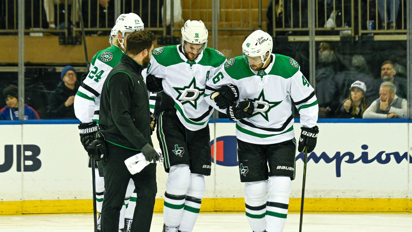 Dallas Stars center Tyler Seguin (91) helped off the ice by Dallas Stars center Roope Hintz (24) and Dallas Stars defenseman Ilya Lyubushkin (46) in the game against the New York Rangers during the first period at Madison Square Garden.