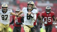 New Orleans Saints quarterback Tyler Shough (6) runs for a gain during the third quarter against the Tampa Bay Buccaneers at Raymond James Stadium.