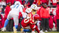Los Angeles Chargers safety Tony Jefferson (23) tackles Kansas City Chiefs wide receiver Tyquan Thornton (80) with a helmet-to-helmet hit during the fourth quarter at GEHA Field at Arrowhead Stadium. Jefferson was ejected for the play. Mandatory Credit: Jay Biggerstaff-Imagn Images