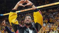 Former Iowa State and Indiana Packer guard Tyrese Haliburton shows heart sign as the unveiling his Olympic 24 gold made banner during the halftime of Cyclones and Wildcats men’s basketball showdown at Hilton Coliseum on Saturday March 1, 2025 in Ames, Iowa.