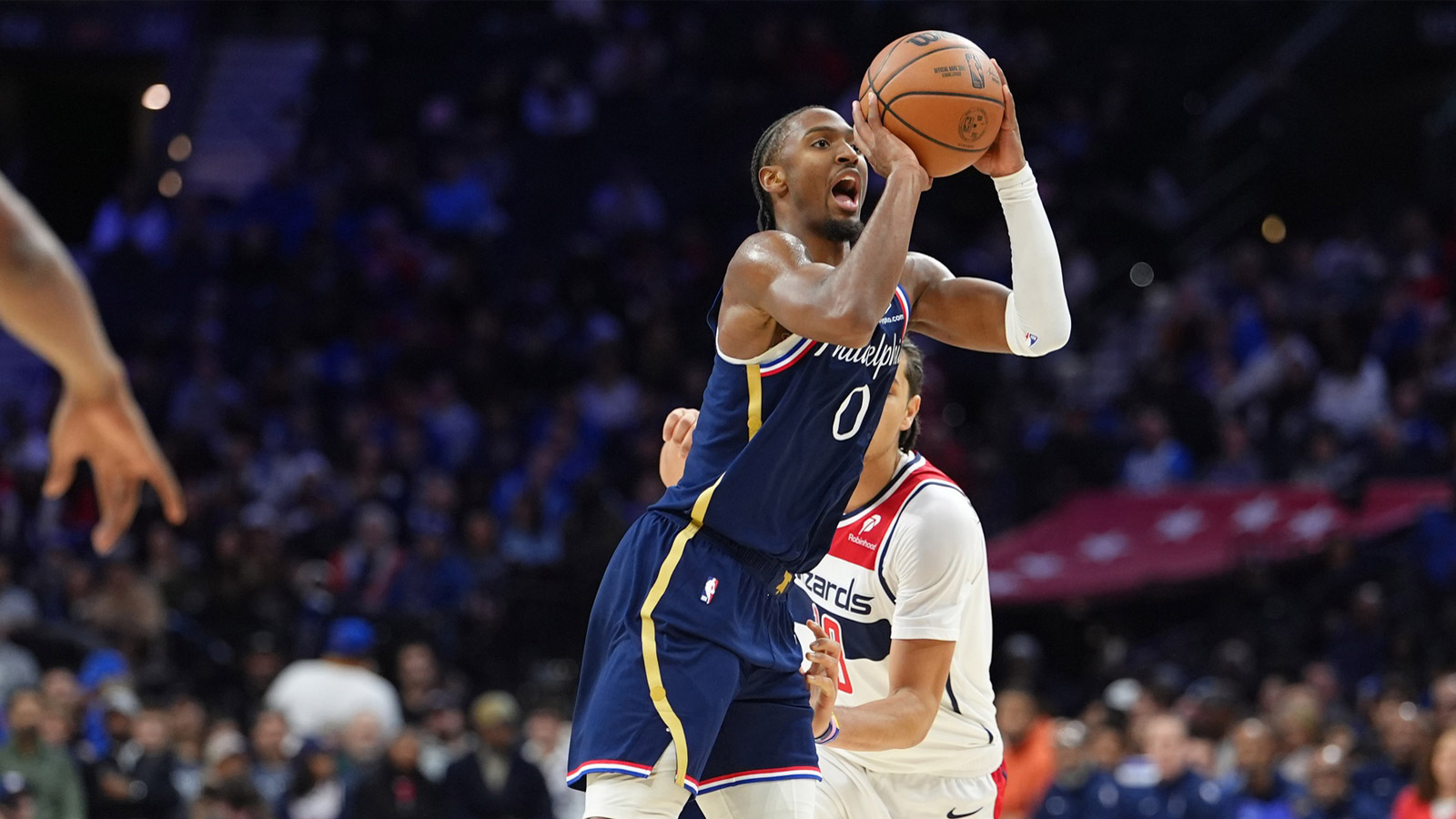 Philadelphia 76ers guard Tyrese Maxey (0) shoots the ball against the Washington Wizards in the third quarter at Xfinity Mobile Arena. 