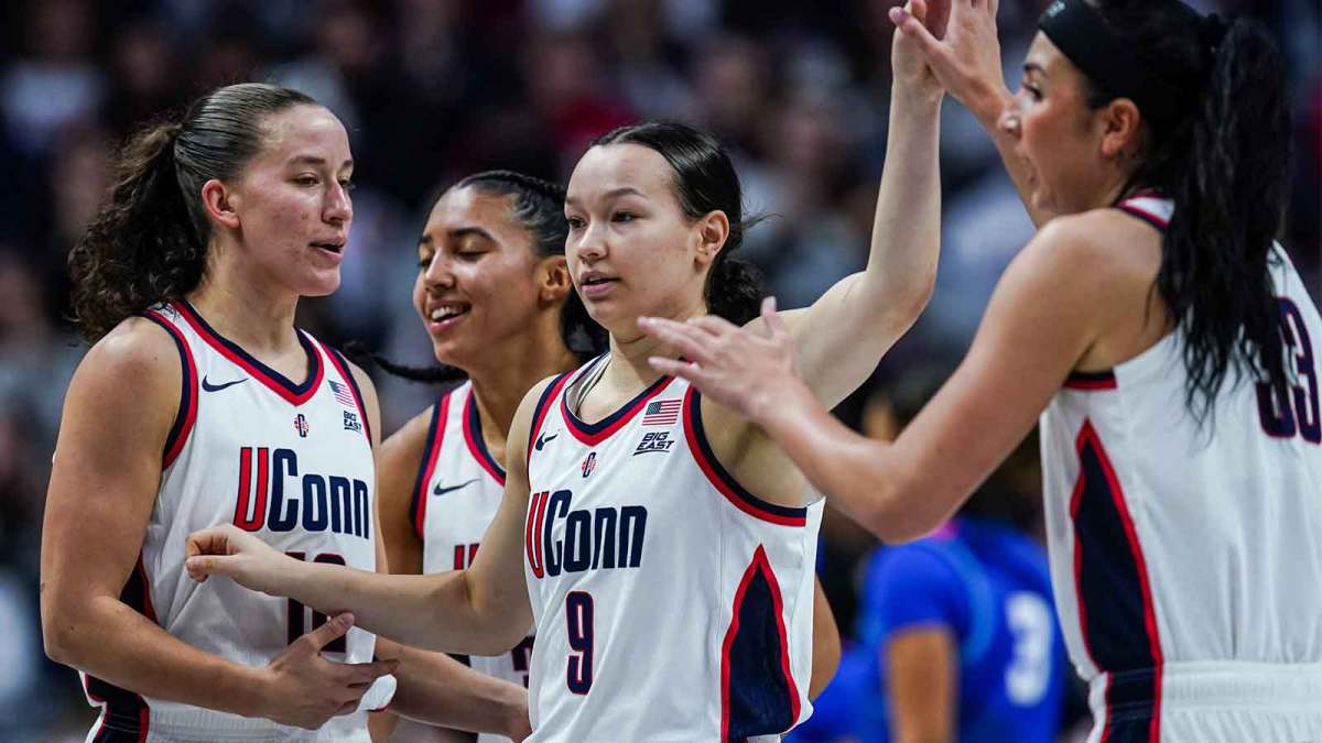 UConn Huskies guard Kayleigh Heckel (9) reacts with teammates guard Ashlynn Shade (12), guard Azzi Fudd (35) and guard Caroline Ducharme (33) aft a play against the DePaul Blue Demons in the first half at Harry A. Gampel Pavilion.