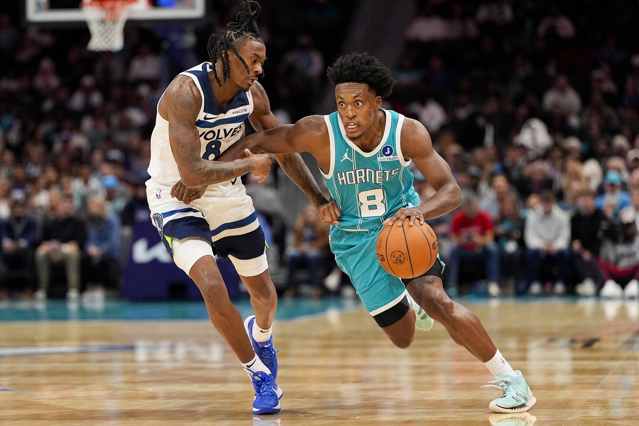 Charlotte Hornets guard Collin Sexton (8) drives to the basket against Minnesota Timberwolves guard Bones Hyland (8) during the second quarter at Spectrum Center. 