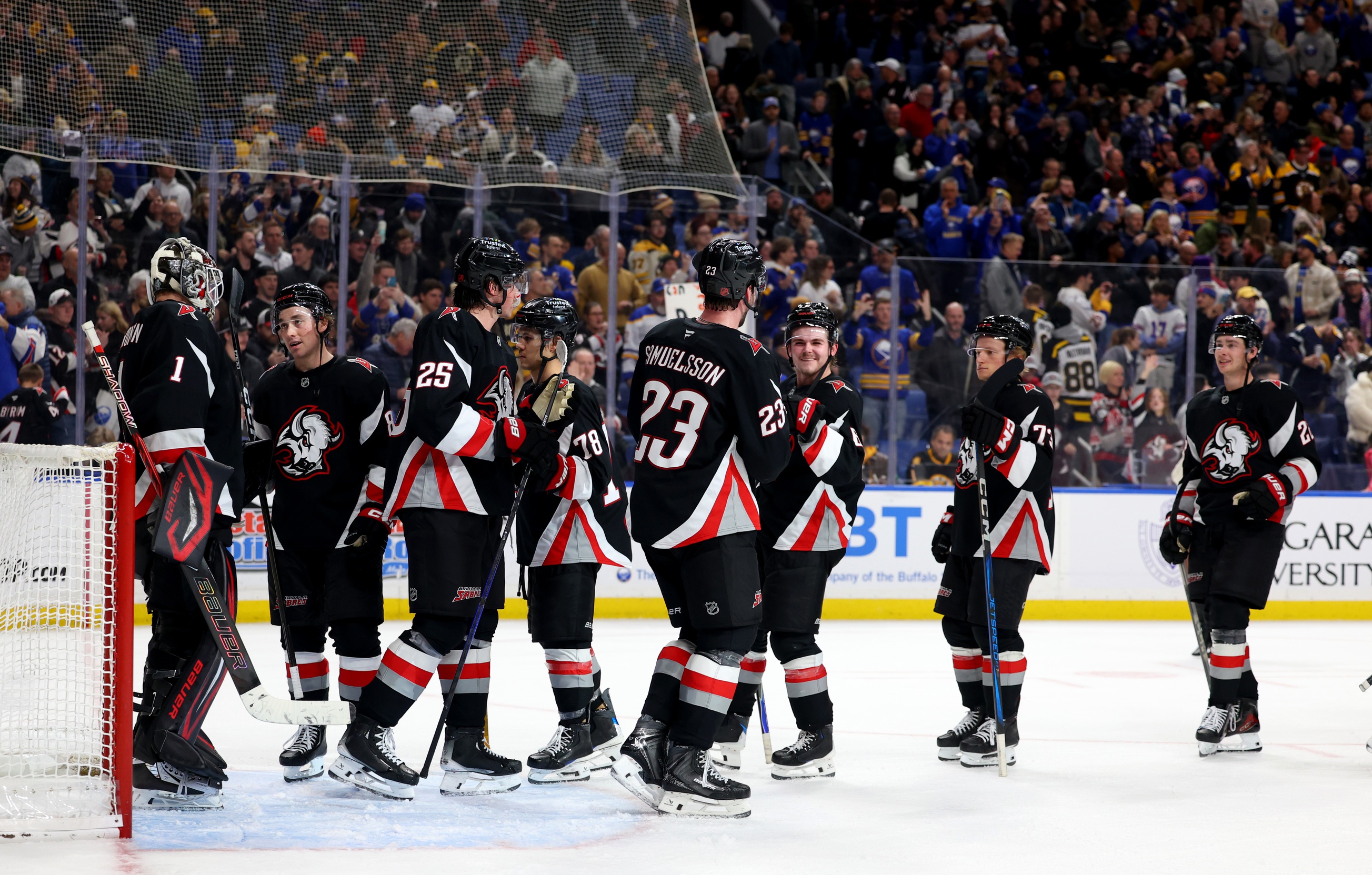 The Buffalo Sabres celebrate a win over the Boston Bruins at KeyBank Center.