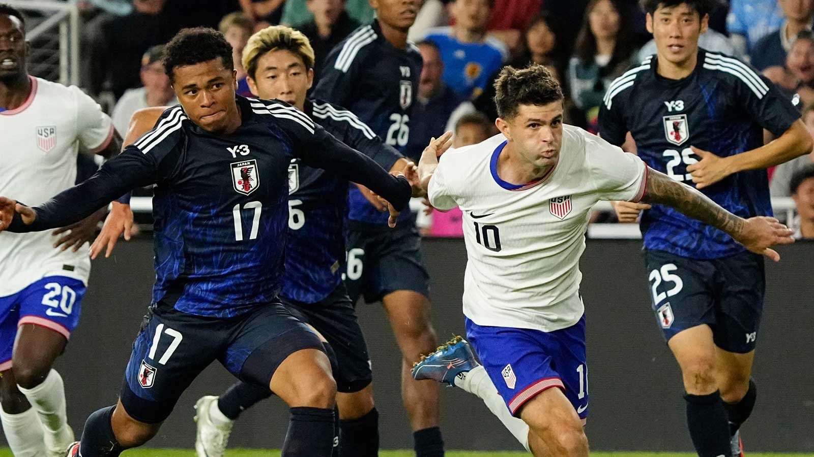 United States forward Christian Pulisic (10) fights with Japan midfielder Joel Chima Fujita (17) during an international friendly soccer match at Lower.com Field in Columbus on Sept. 9, 2025. The United States Men's National Team won 2-0.