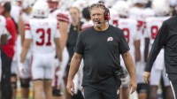 Utah Utes head coach Kyle Whittingham walks along the sidelines during the second quarter against the West Virginia Mountaineers at Milan Puskar Stadium.