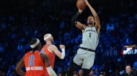 San Antonio Spurs forward Victor Wembanyama (1) shoots the ball over Oklahoma City Thunder guard Alex Caruso (9) during the third quarter at T-Mobile Arena.