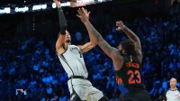 San Antonio Spurs forward Victor Wembanyama (1) shoots the ball over New York Knicks center Mitchell Robinson (23) during the Emirates NBA Cup Final at T-Mobile Arena.