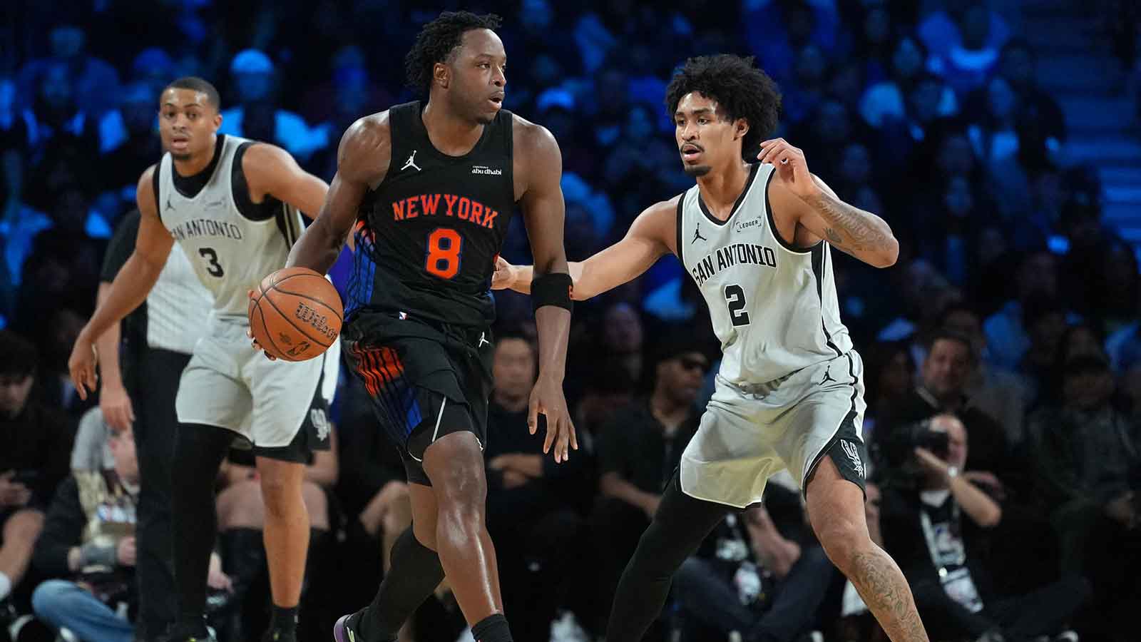 New York Knicks forward Og Anunoby (8) dribbles the ball against San Antonio Spurs guard Dylan Harper (2) during the Emirates NBA Cup Final at T-Mobile Arena.