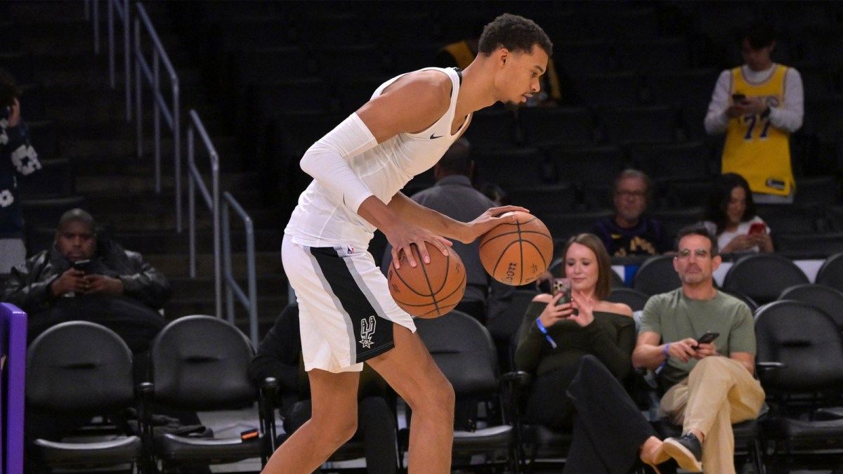 Spurs forward Victor Wembanyama (1) warms up prior to the game against the Los Angeles Lakers at Crypto.com Arena