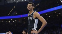San Antonio Spurs forward Victor Wembanyama (1) smiles after a play against the Oklahoma City Thunder during the second half at Paycom Center.