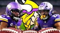 Aaron Jones and Jordan Mason playing football with the Vikings logo in between them.